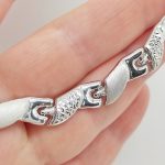 Ezüst elől szélesedő metszett nyakék