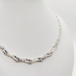 Ezüst elől szélesedő metszett nyakék