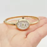 Sárga arany női karperec óra