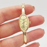 Sárga arany női karperec óra