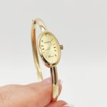 Sárga arany női karperec óra