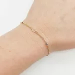 Sárga arany karlánc kis virágokkal