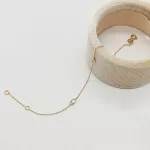 Sárga arany szolíd köves karlánc