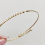 Sárga arany nyitott bogyós karperec