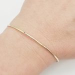 Sárga arany nyitott bogyós karperec