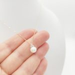 Sárga arany nyaklánc gyöngy medállal