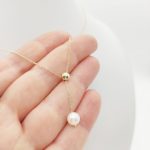 Sárga arany nyaklánc gyöngy medállal