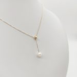 Sárga arany nyaklánc gyöngy medállal