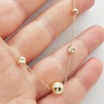 Sárga arany nyaklánc bogyókkal