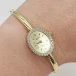 Sárga arany női karperec óra