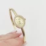 Sárga arany női karperec óra