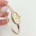 Sárga arany női karperec óra