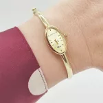 Sárga arany női karperec óra