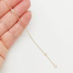 Sárga arany karlánc egy köves medállal