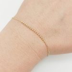 Sárga arany karlánc apró bogyókkal