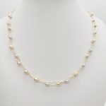 Sárga arany dupla soros nyaklánc sárga-fehér metszett bogyókkal
