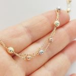 Sárga arany dupla soros nyaklánc trikolor metszett bogyókkal