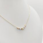 Sárga arany nyaklánc trikolor metszett bogyókkal