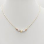 Sárga arany nyaklánc trikolor metszett bogyókkal