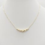 Sárga arany nyaklánc metszett bogyókkal