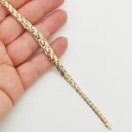 Sárga arany elől szélesedő elegáns karlánc