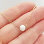 Sárga arany nyaklánc gyöngy medállal