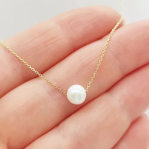 Sárga arany nyaklánc gyöngy medállal