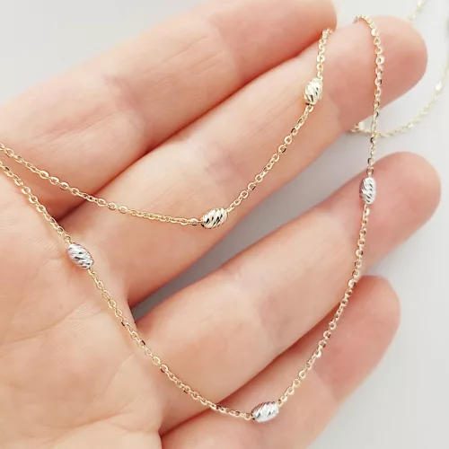 Sárga arany nyaklánc sárga-fehér orsókkal