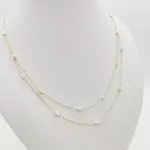 Sárga arany nyaklánc sárga-fehér orsókkal