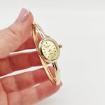 Sárga arany női karperec óra