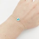 Sárga arany gyermek karlánc kék tappancsokkal