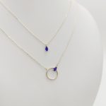 Sárga arany nyaklánc kék kővel