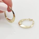 Sárga arany alul szélesedő karika fülbevaló