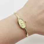 Sárga arany ovális számlapú karperec óra