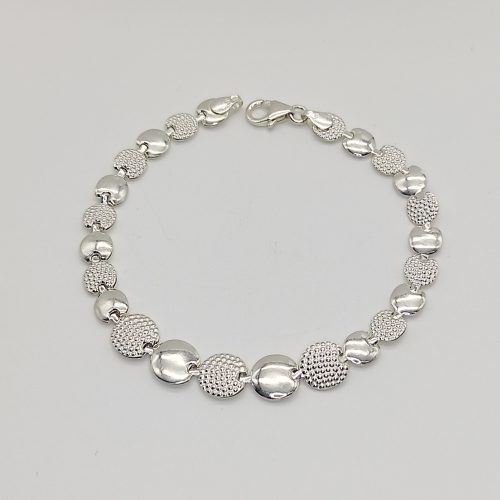 Ezüst elől szélesedő kerek mintás szegedi karlánc - 17,5cm