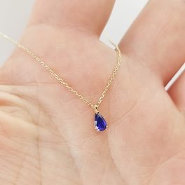 Sárga arany nyaklánc kék csepp alakú kővel
